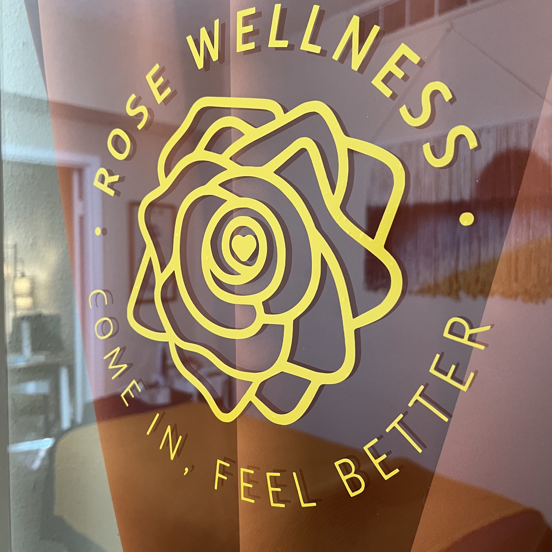 front door of therapy office with rose wellness logo